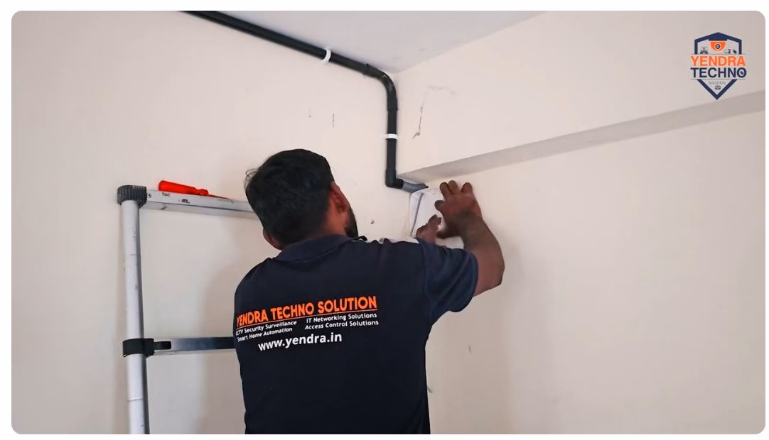 Yendra technician servicing a factory CCTV camera